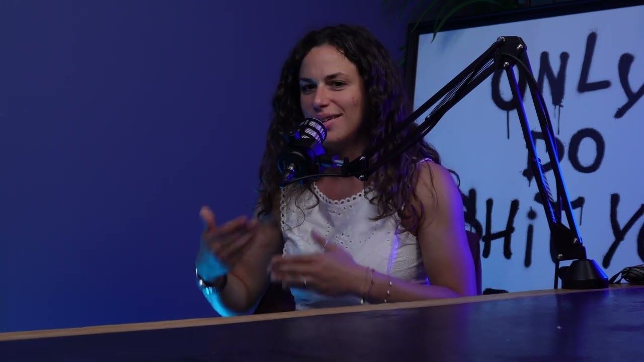 Podcast host speaking into a microphone